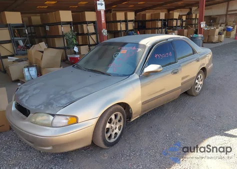 1999 Mazda 626 Es/Lx z USA, uszkodzony, nr VIN 1YVGF22C0X5869205